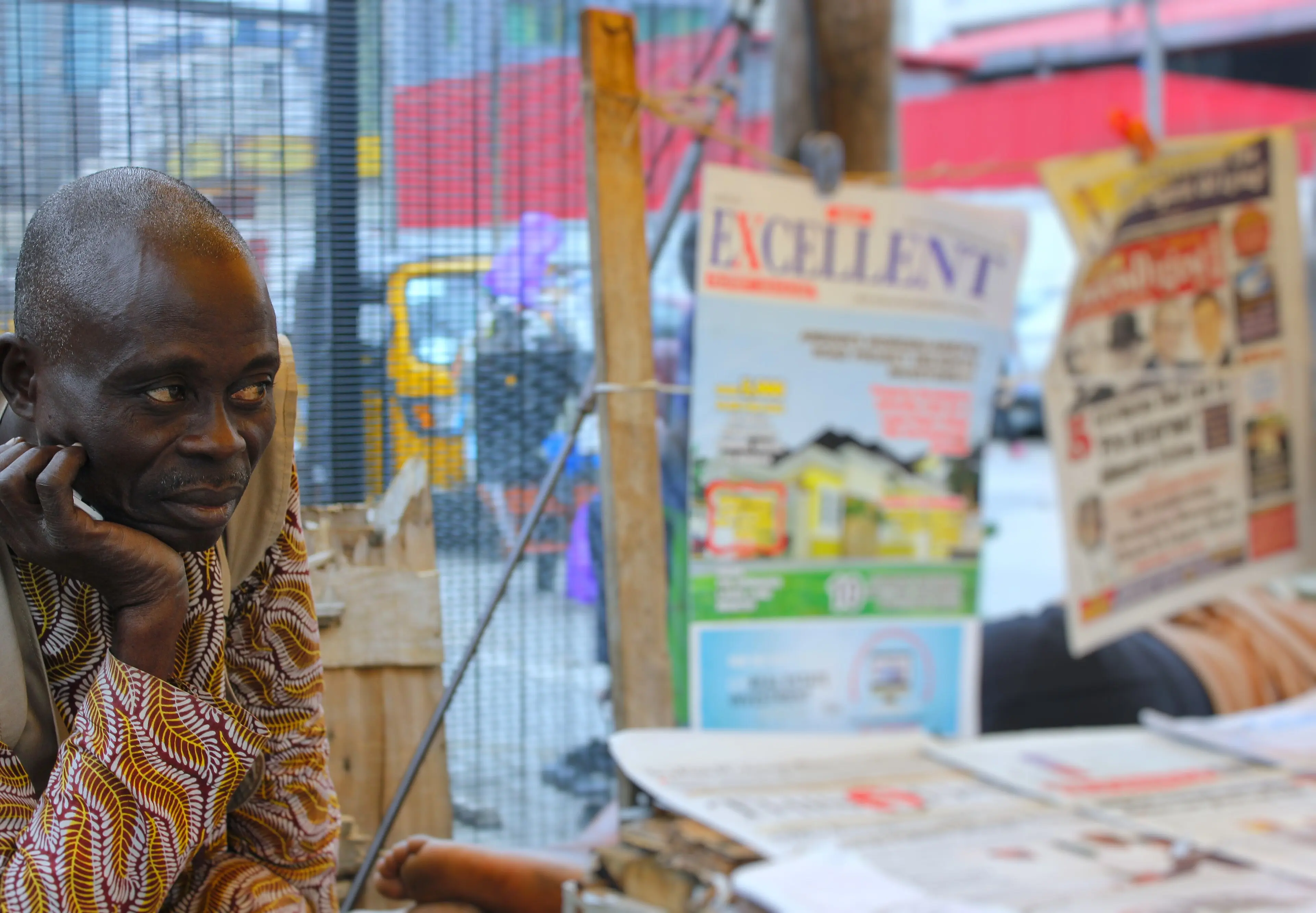 A newspaper vendor's stand in Nigeria with the day's front pages laid out